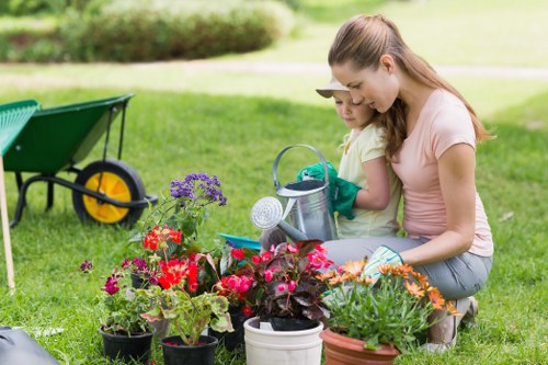 Professional landscapers improving a Chessington garden